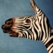 Very detailed paintings of animals, painted directly onto others' hands.
