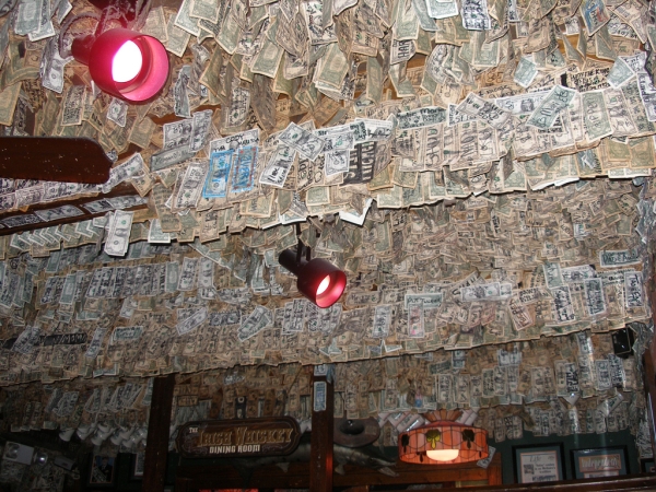 McGuire's Irish Pub, over $550,000 in dollar bills stuck on the walls and ceiling.