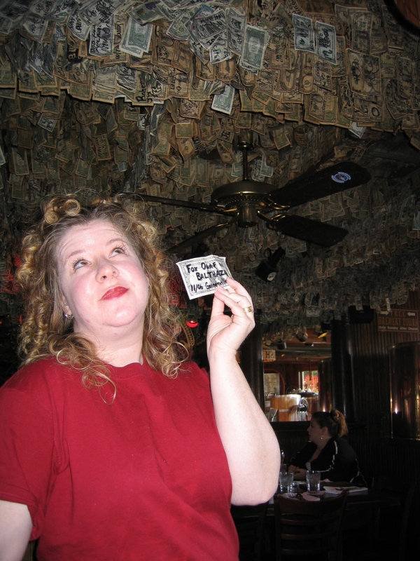 McGuire's Irish Pub, over $550,000 in dollar bills stuck on the walls and ceiling. The story goes that Molly, the first waitress, took her first dollar tip and tacked it on the wall.