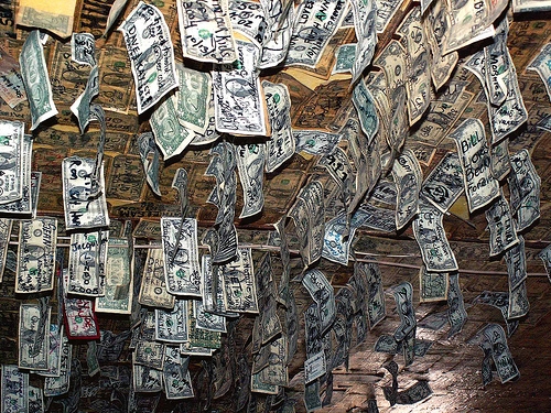 Oatman Hotel, nobody seems to know why, but visitors seem to leave a dollar bill behind with their name and where they're from.