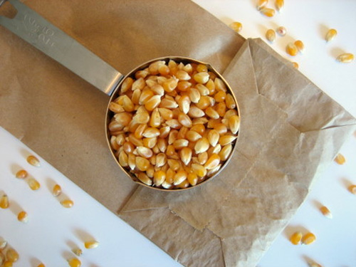 Microwave your own popcorn in a plain brown paper bag. Much healthier and cheaper than the packet stuff.