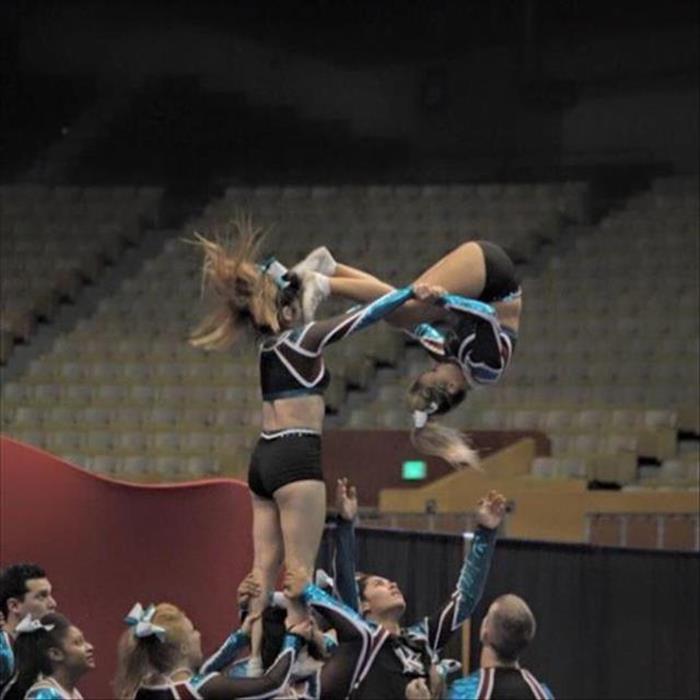 cheerleader gets kicked in face
