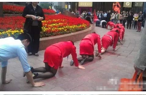 Another CEO forced his team to do the crawl in a busy town square.