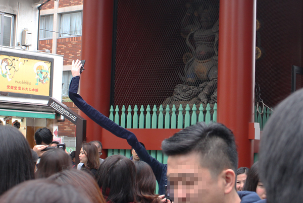 Man Embarrassed to Use Selfie Stick Creates Ridiculous Selfie Arms Instead