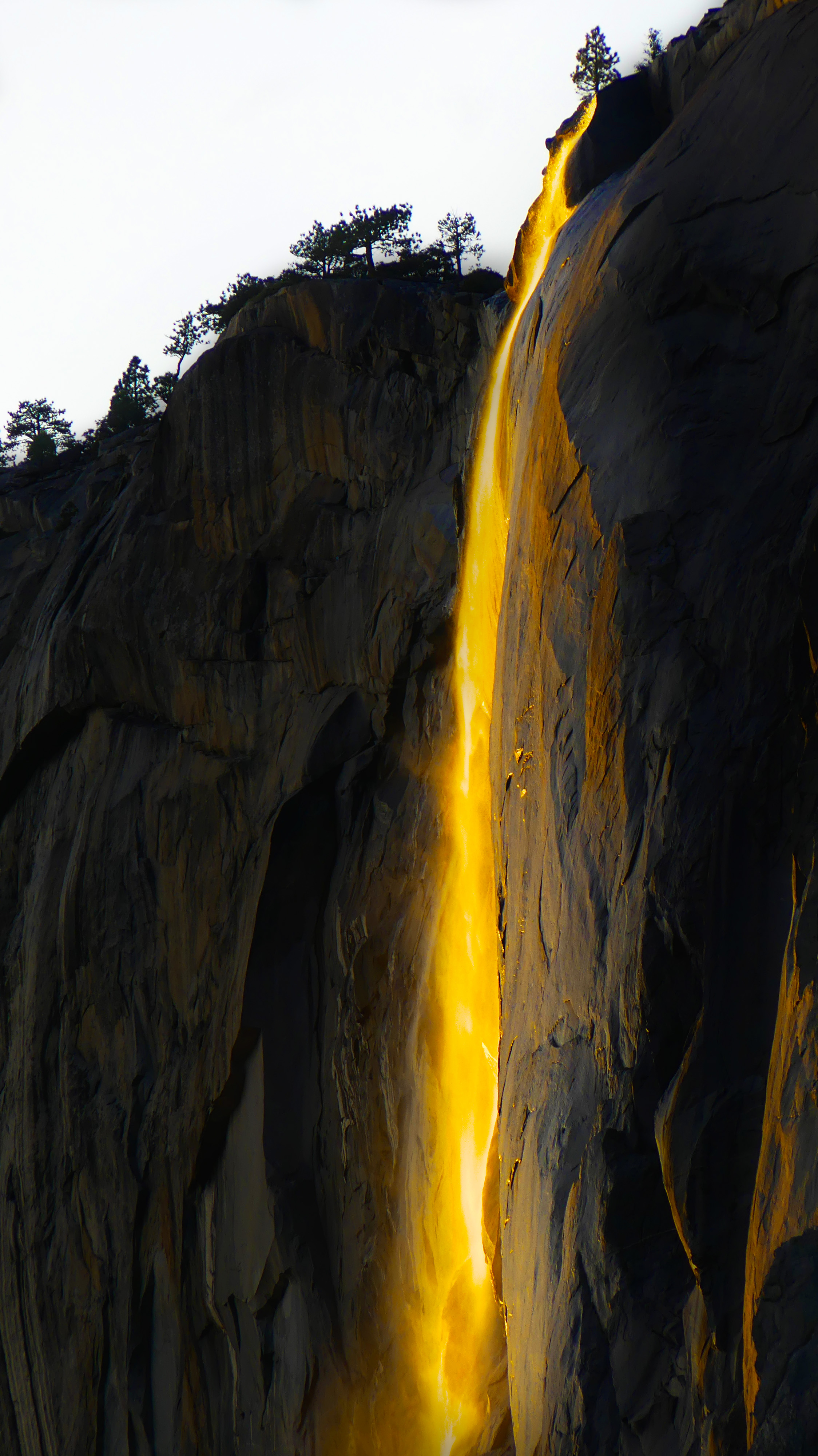 Yosemite's Horsetail Falls illuminated by the sun making it look as if the water were on fire. 