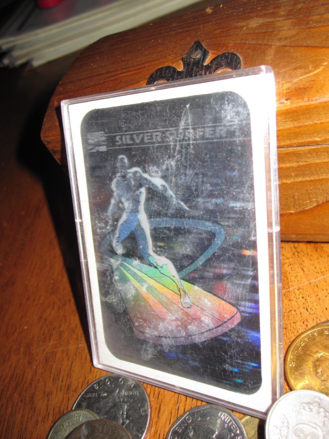 It was this awesome retro Silver Surfer card in a protective case.