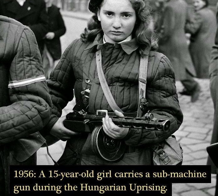 erika 1956 - 1956 A 15yearold girl carries a submachine gun during the Hungarian Uprising.