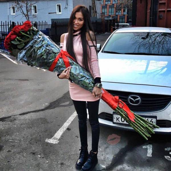 Girl with oversized bouquet of flowers