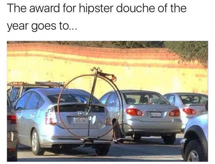Award for hipster douche of the year goes to the silver Toyota Prius with the Penny-Farthing on the bike mount on the back.