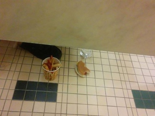 Someone eating McDonald's off the bathroom floor in the stall next to yours