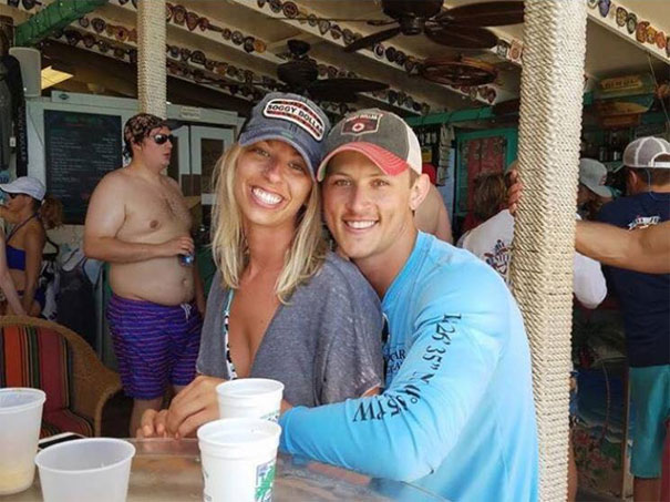The original photo of the couple who has the fat dude in the background the friend requested to have photoshopped out of the pic.
