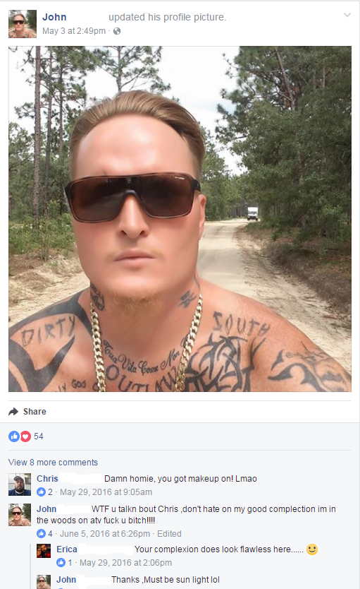 Dude with lots of tattoos takes a selfie that looks like he is wearing foundation makeup, but denies it in the comments.