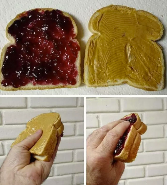 Peanut butter & jelly sandwich made to be eaten in the most stressful way, with the peanut butter and the jelly on the outside of the sandwich and will certainly get the person's hands filthy in eating it.
