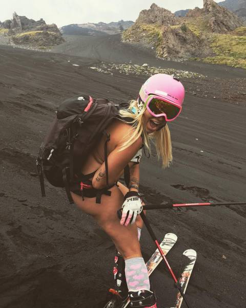 Naked woman skiing on a volcano