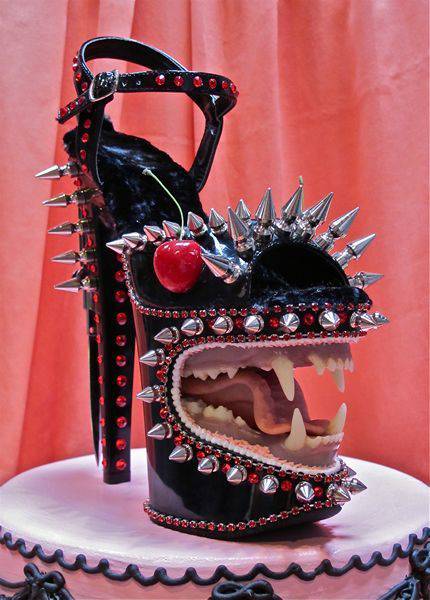 High heel shoes with a crazy sculpture of a mouth.