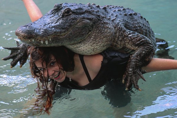 Girl with alligator on her back