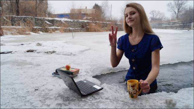 Girl posing as if she is at work in the middle of a frozen river.