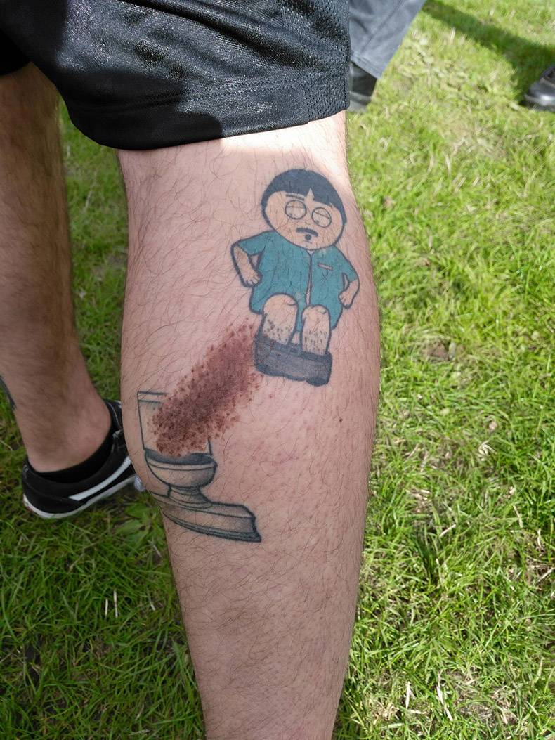 Man with scar on his leg made complete with a south park tattoo
