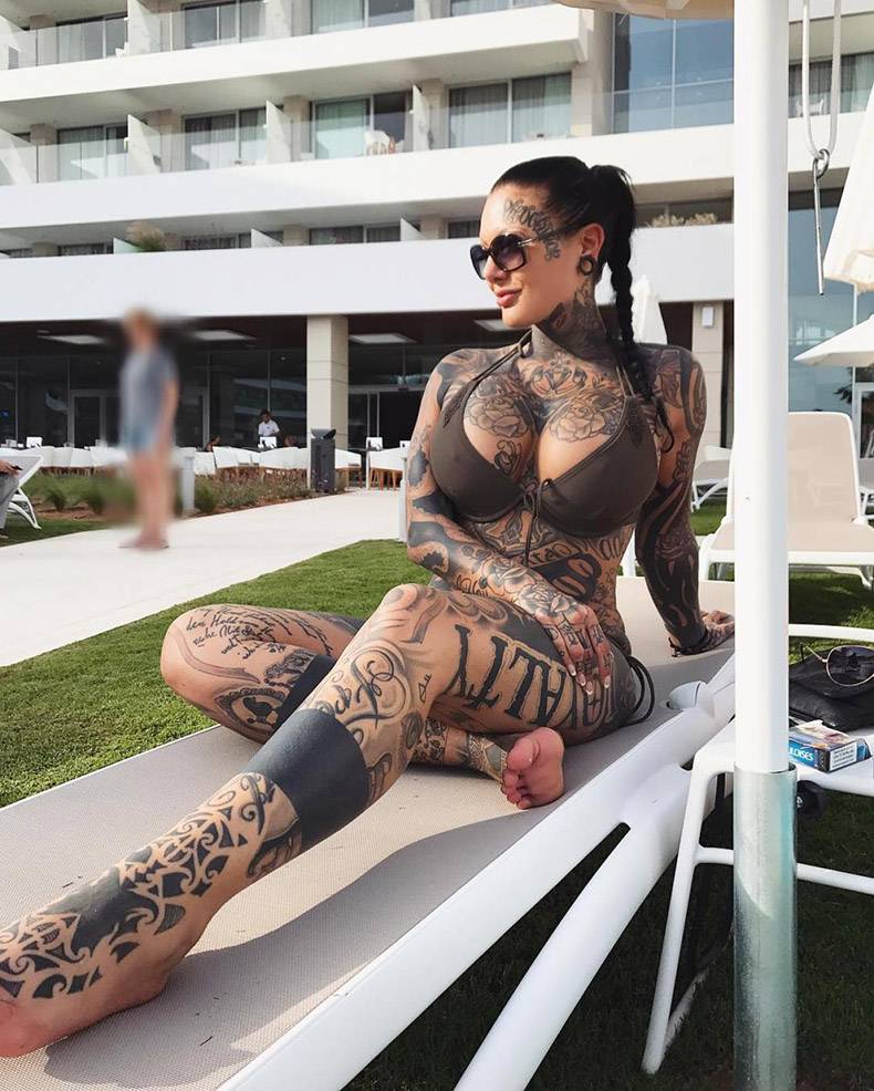 Girl with tattoos all over in a bikini