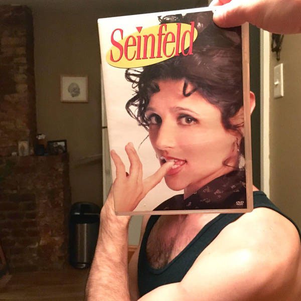 Posing with Seinfeld DVD covers
