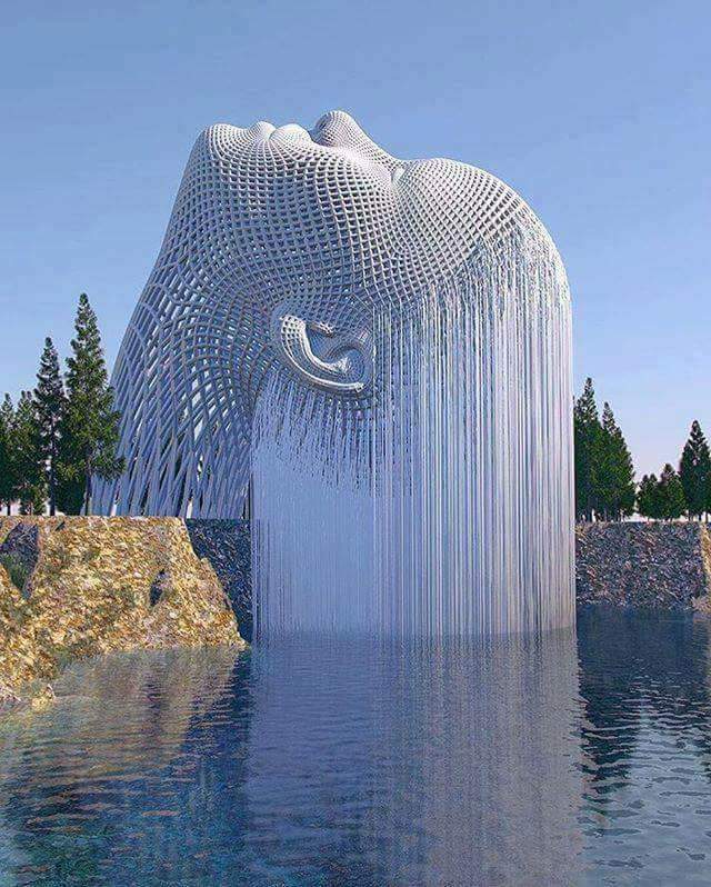 awesome fountain that looks like woman with long hair emerging from the water