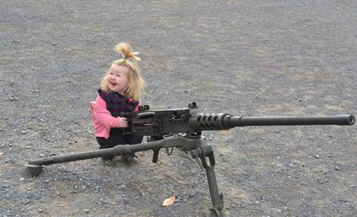 baby girl with gun