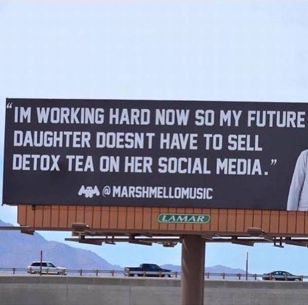 Funny billboard about working hard so that her kid won't have to sell detox tea on her social media