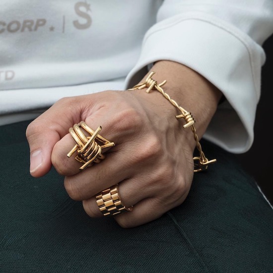 Gold ring and bracelet that looks like barbed wire.