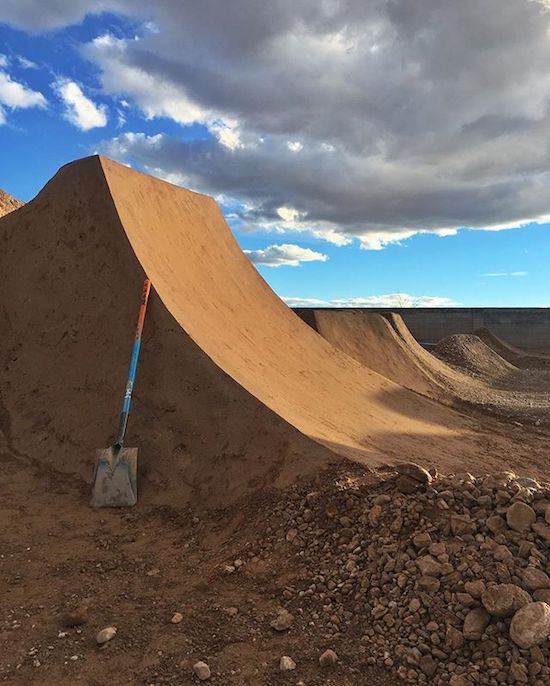 Perfectly rounded and smooth half pipe made in the sand and dirt.