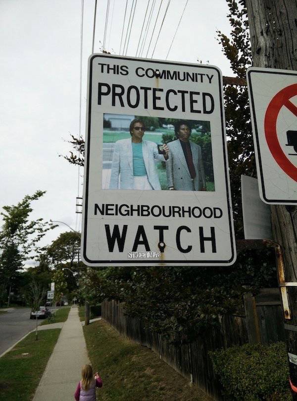 street sign - This Community Protected Neighbourhood Watch Siript