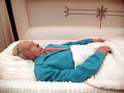 old woman in a casket