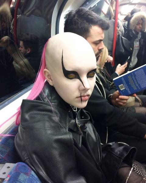 creepy mask on a train