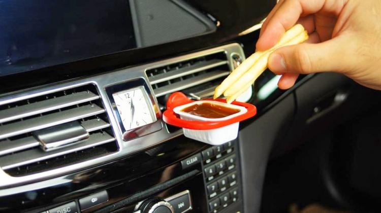 The Saucemoto™ Dip Clip connects to any A/C vent in your car to keep your dip cups close. <br/><br/>This is going to run you about <a href="https://amzn.to/2HXBCur">$5.50 on Amazon</a>.