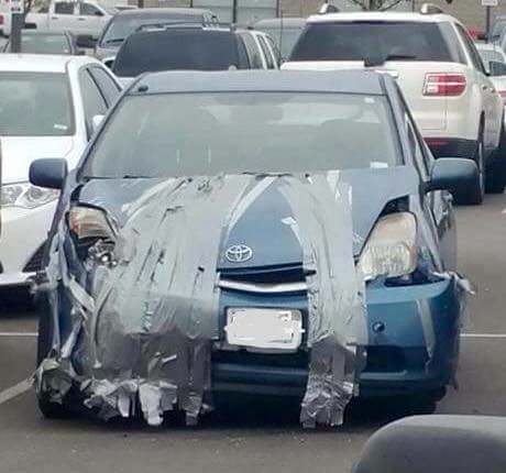 funny picture Toyota that is repaired perfectly with duct tape
