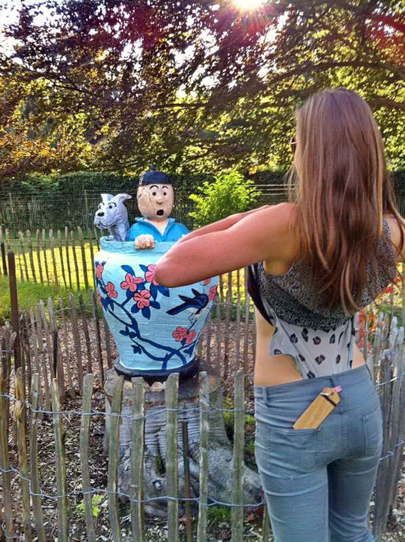 girl flashing surprised statue
