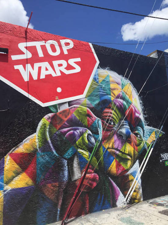 graffiti of Yoda in psychedelic form with STOP WARS sign