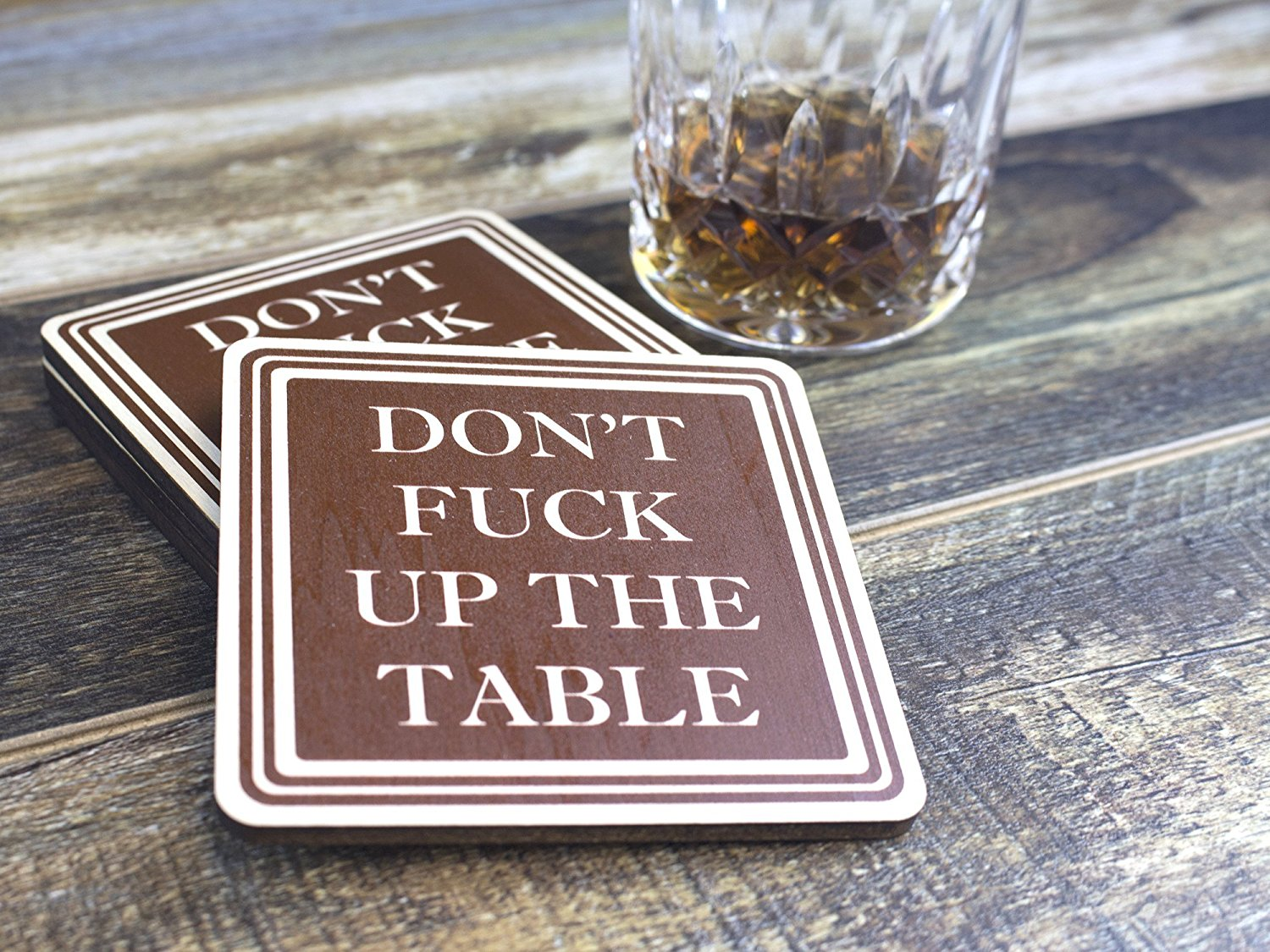 A coaster that says "DON'T FUCK UP THE TABLE" is probably the exact message you want to send to your houseguests. Get one <a href=https://amzn.to/2LMOhBJ "nofollow" target="_blank">here.</a>