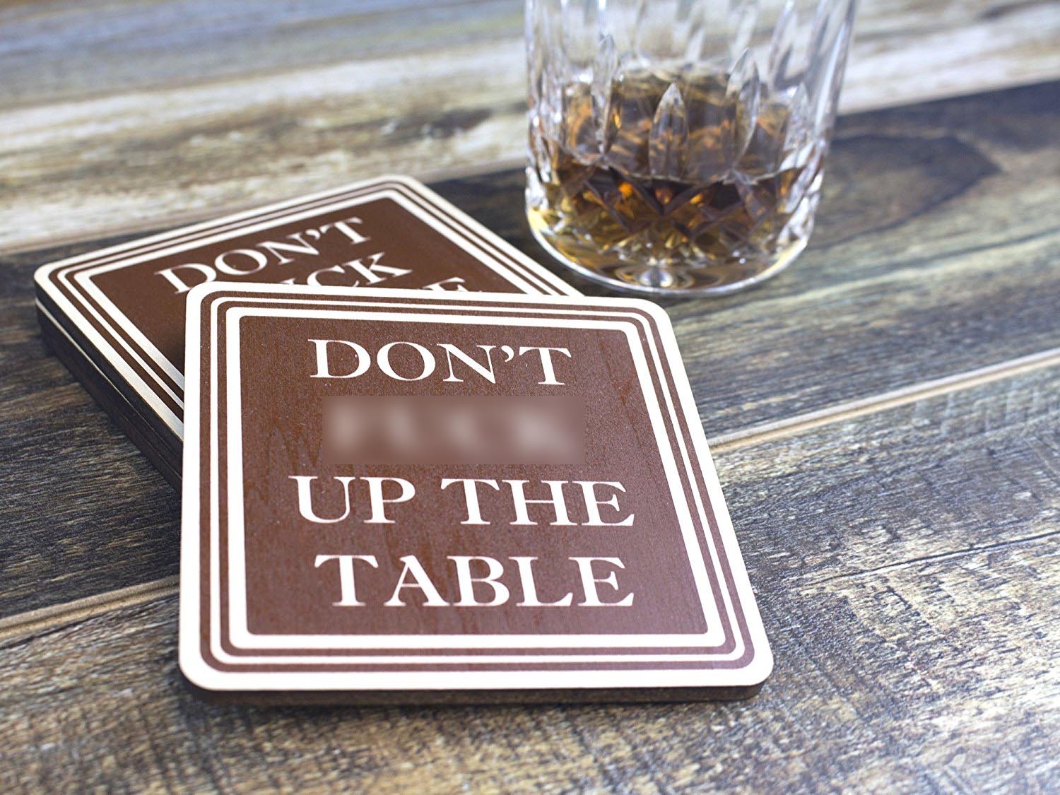 A coaster that says "DON'T F**K UP THE TABLE" is probably the exact message you want to send to your houseguests.</br></br>Get one <a href=https://amzn.to/2LMOhBJ "nofollow" target="_blank">here.</a>