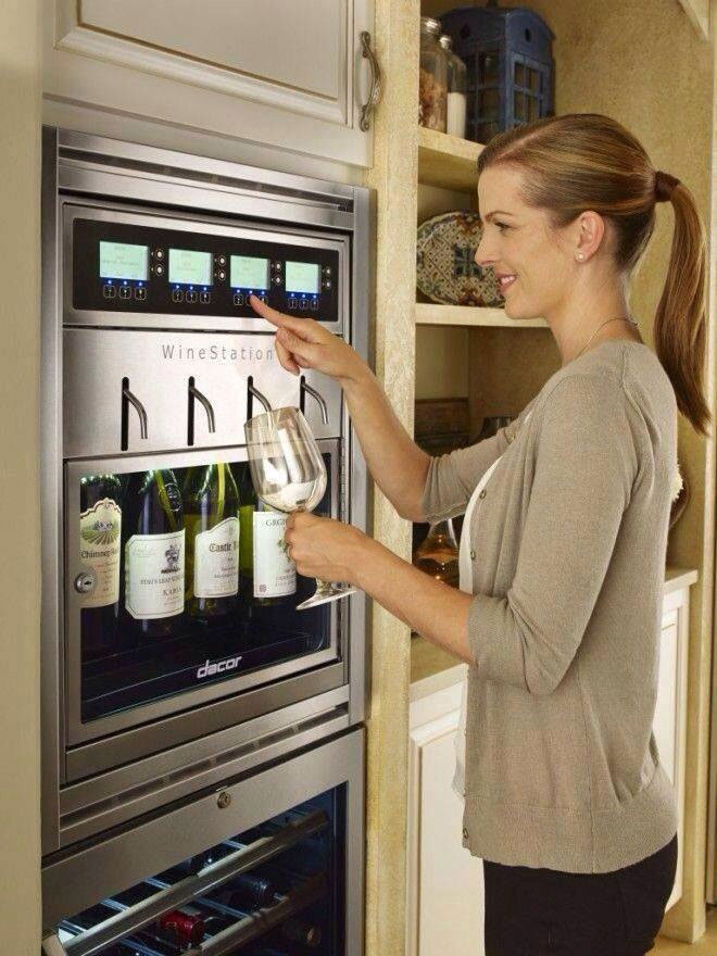 white woman with wine dispense in her fance kitchen