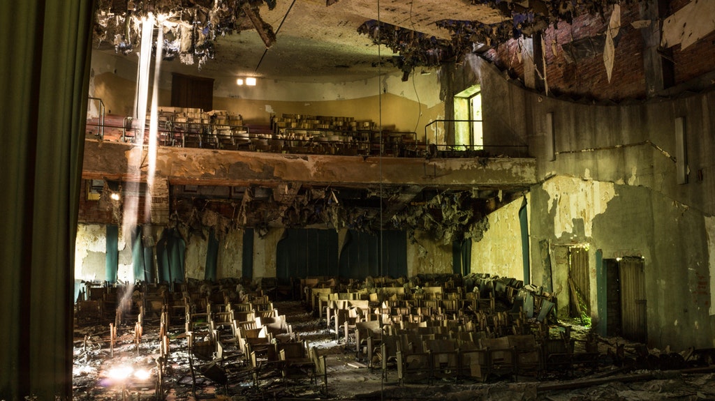 A theater in an abandoned mental hospital.