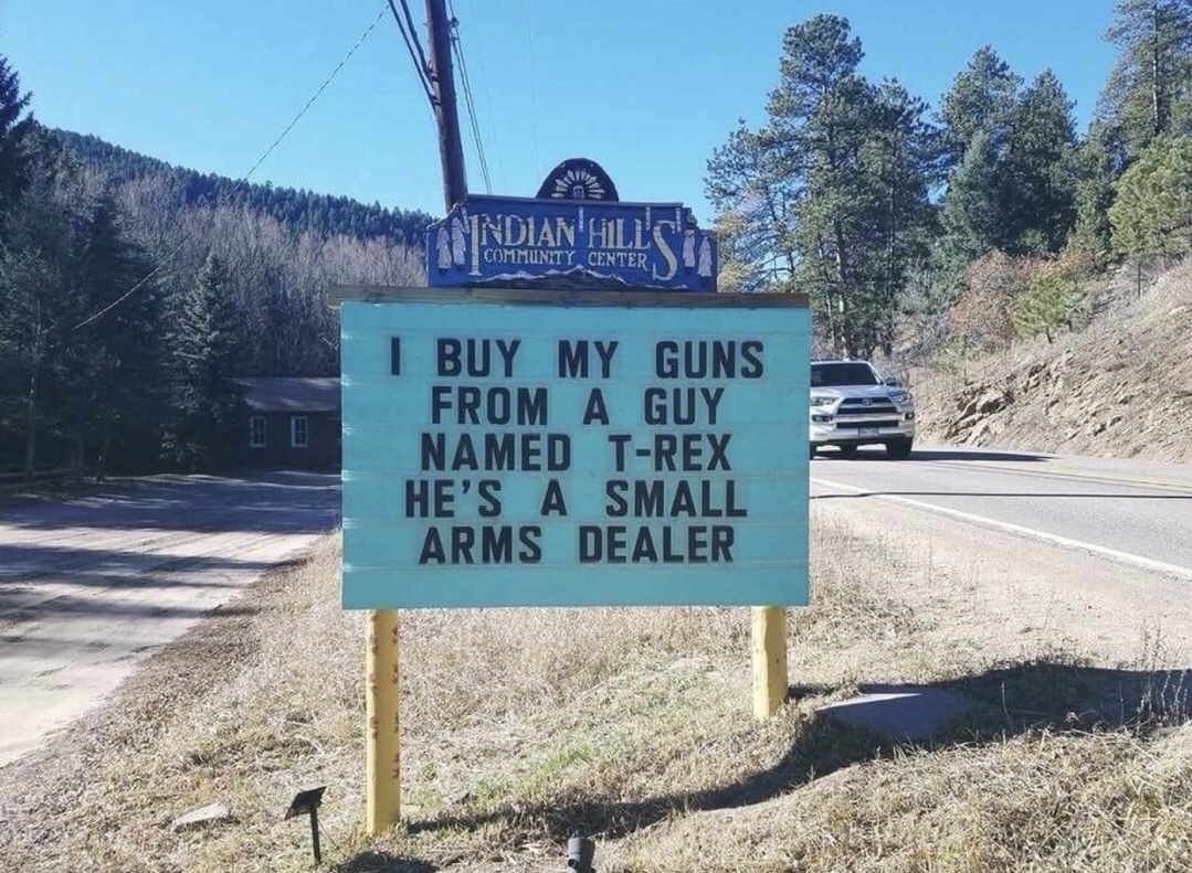 memes - indian hills sign puns - Nip Nindian Hill Community Center I Buy My Guns From A Guy Named TRex He'S A Small Arms Dealer
