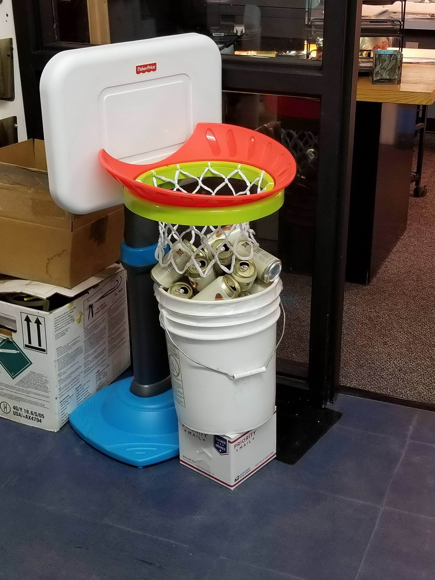 basketball hoop over the wastepaper basket