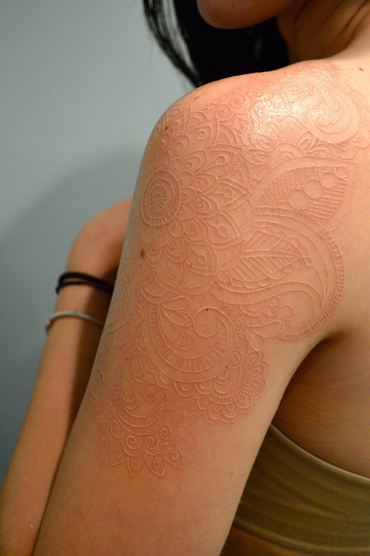 girl with elaborate scar tattoos