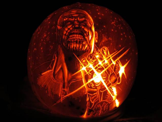 thanos with infinity gauntlet carved into pumpkin