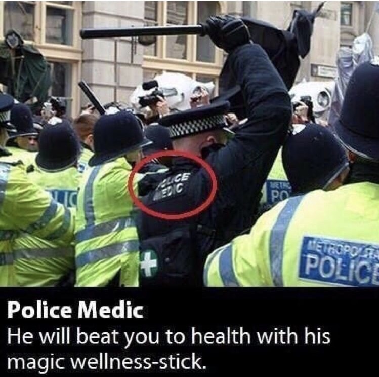 Police medic beating protestors with sticks