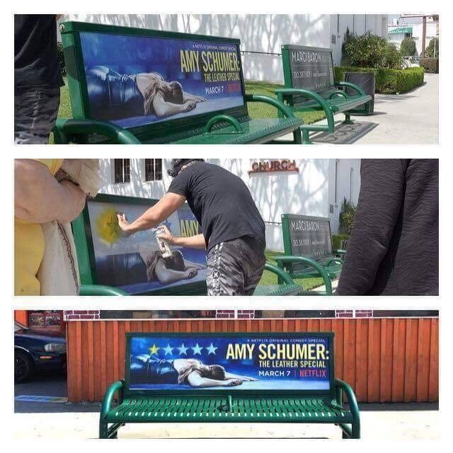 Amy Schumer advertisement on a bench and someone paints over it giving only 1 star out of 5