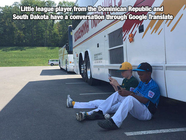 athletes on phones - Little league player from the Dominican Republic and South Dakota have a conversation through Google Translate Su Bao