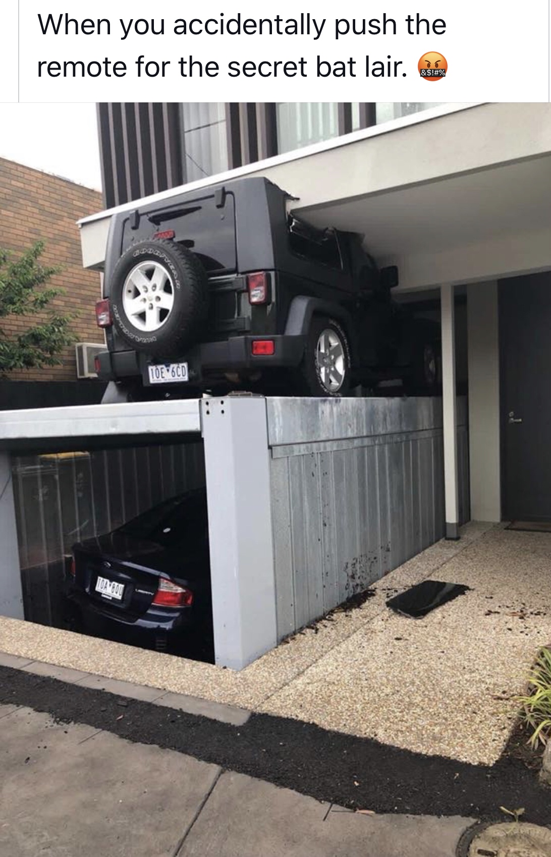 underground car lift fail - When you accidentally push the remote for the secret bat lair.