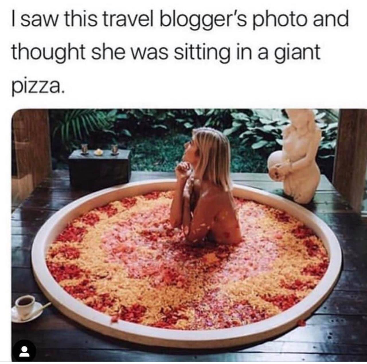 dish - I saw this travel blogger's photo and thought she was sitting in a giant pizza.