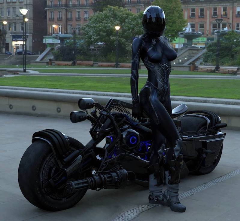 meme with a female biker in a black body suit posing with a motorcycle